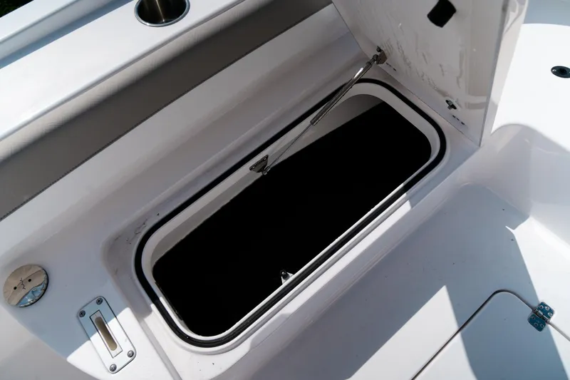 Slide: The Image of Open storage compartment on 2025 Caymas 28 HB boat, showcasing interior space. - 28