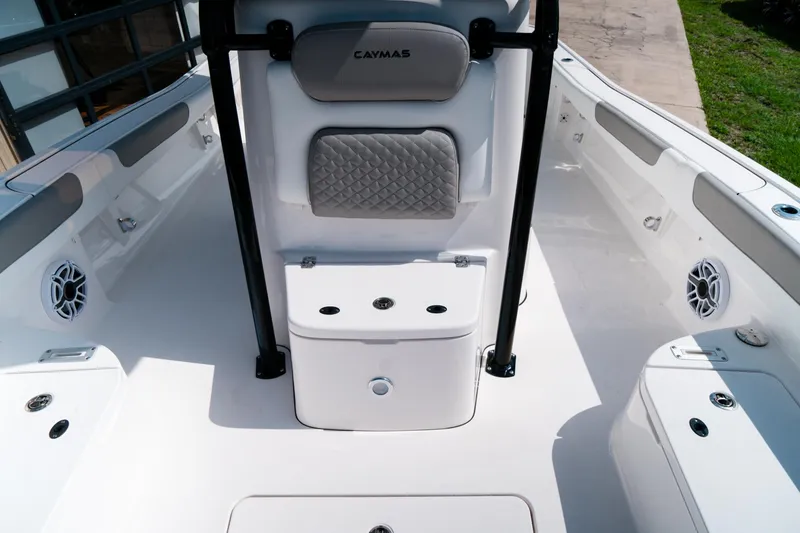 Slide: The Image of 2025 Caymas 28 HB boat interior with seating and storage compartments. - 29