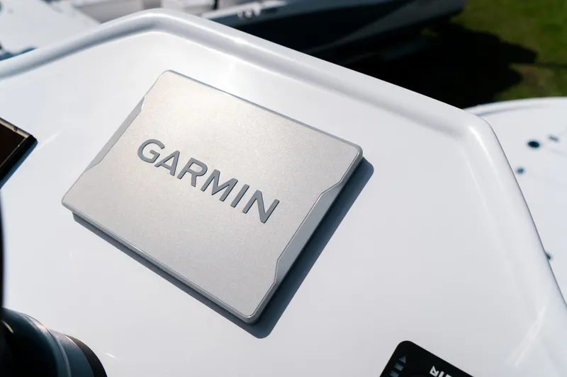 Slide: The Image of Garmin device on 2025 Caymas 28 HB boat dashboard, close-up view. - 34