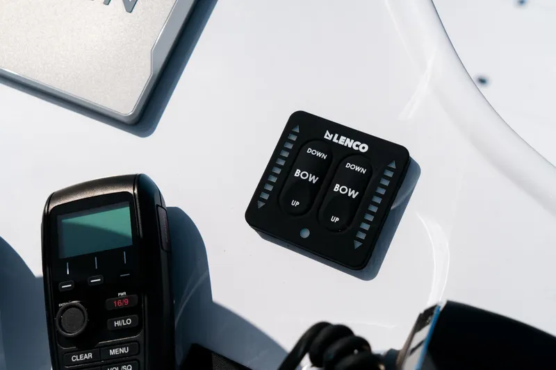 Slide: The Image of Control panel on 2025 Caymas 28 HB boat with Lenco trim tab switches. - 35
