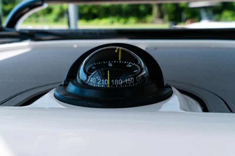 Slide: The Image of Compass on 2025 Caymas 28 HB boat dashboard, close-up view. - 38