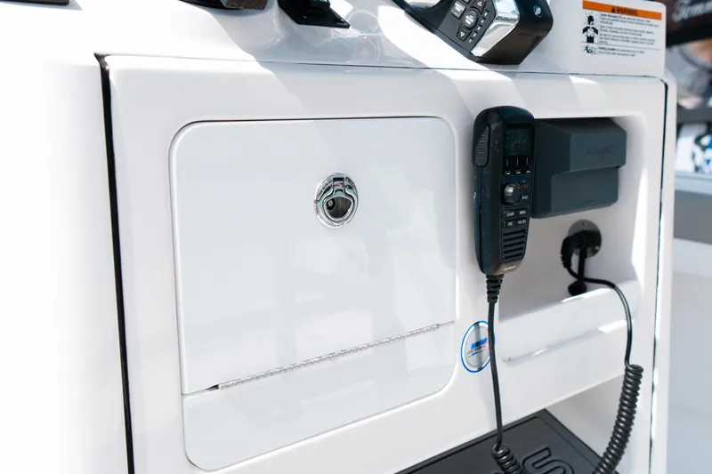 Slide: The Image of 2025 Caymas 28 HB boat console with communication equipment and storage compartment. - 45