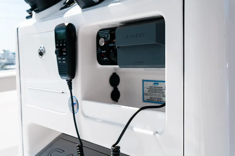 Slide: The Image of 2025 Caymas 28 HB boat console with radio and control panel. - 47