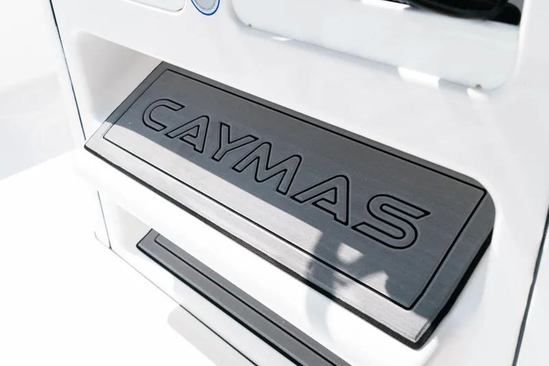 Slide: The Image of 2025 Caymas 28 HB boat step with embossed logo in sleek design. - 48