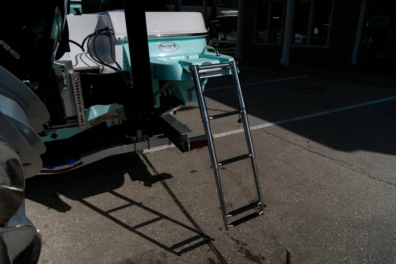 Slide: The Image of 2025 Caymas 28 HB boat with a ladder on a concrete surface. - 7