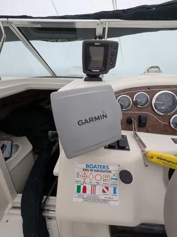 Slide: The Image of 1999 Sea Ray 215 Express Cruiser dashboard with Garmin navigation system. - 15