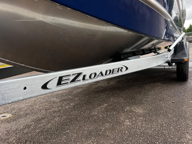 Slide: The Image of 2025 Thunder Jet 210 Luxor on EZ Loader trailer, close-up view. - 13