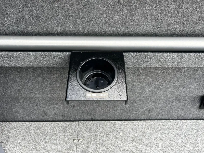 Slide: The Image of 2025 Thunder Jet 210 Luxor boat interior with cup holder and "Do Not Step" label. - 22