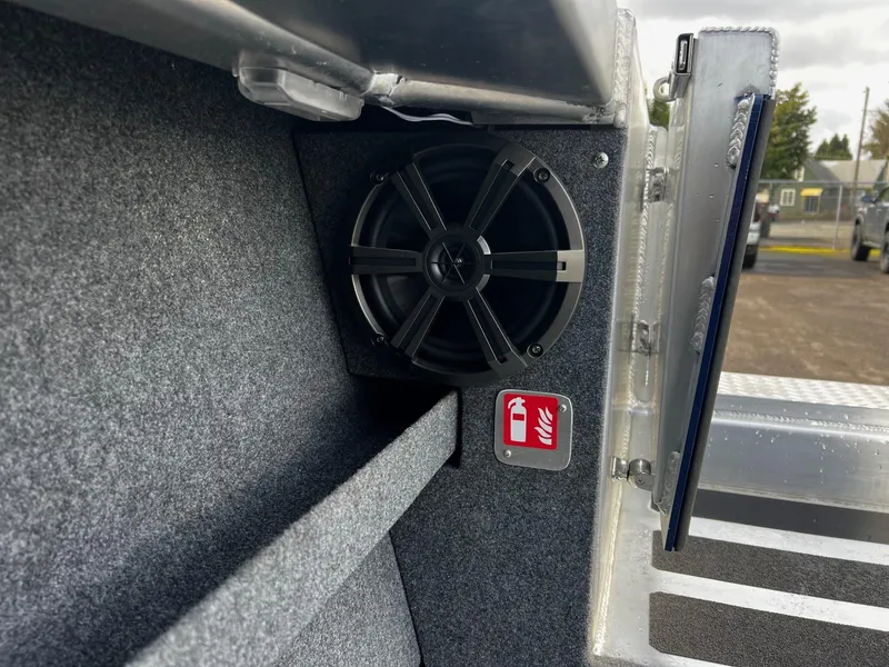 Slide: The Image of 2025 Thunder Jet 210 Luxor interior speaker and fire extinguisher sign detail. - 24