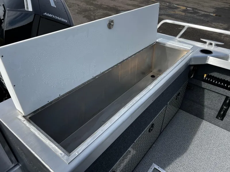 Slide: The Image of 2025 Thunder Jet 210 Luxor boat storage compartment, open lid, spacious interior, sleek design. - 28