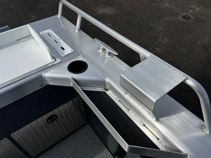 Slide: The Image of 2025 Thunder Jet 210 Luxor boat interior with aluminum railing and storage compartments. - 31