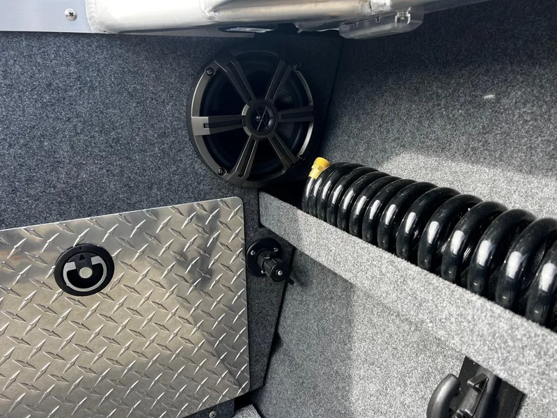 Slide: The Image of Interior of 2025 Thunder Jet 210 Luxor boat with speaker and diamond plate panel. - 33