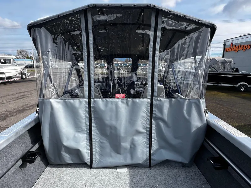 Slide: The Image of 2025 Thunder Jet 210 Luxor boat with protective cover and clear windows. - 37