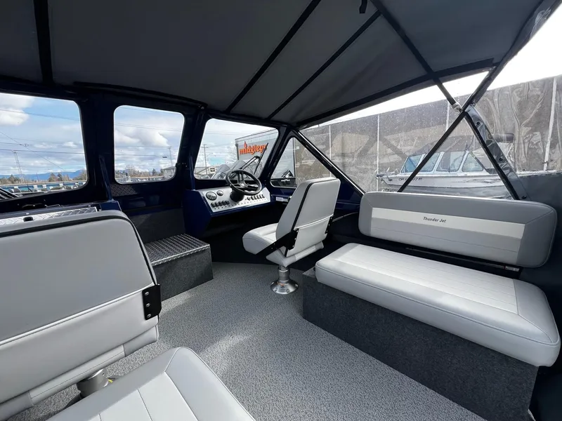 Slide: The Image of Interior of 2025 Thunder Jet 210 Luxor boat with seating and steering console. - 43