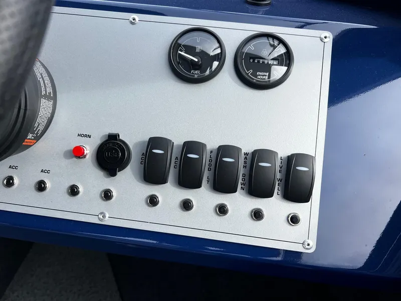 Slide: The Image of Control panel of 2025 Thunder Jet 210 Luxor boat with switches and gauges. - 48