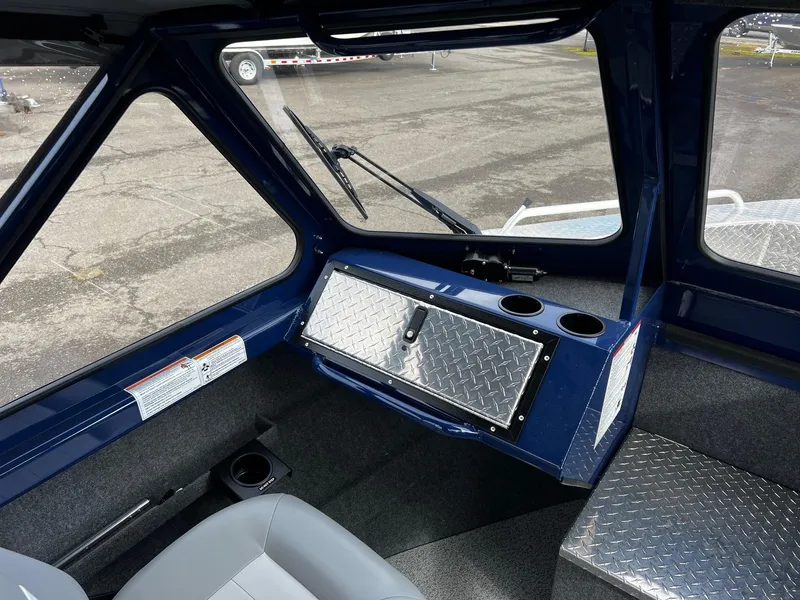 Slide: The Image of Interior of 2025 Thunder Jet 210 Luxor boat with diamond plate accents and seating. - 49