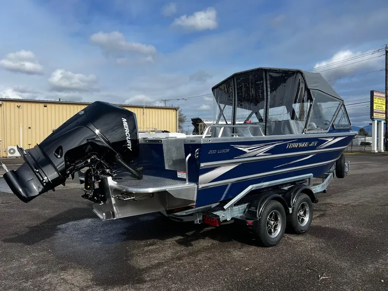 Slide: The Image of 2025 Thunder Jet 210 Luxor boat with Mercury outboard motor on a trailer. - 9