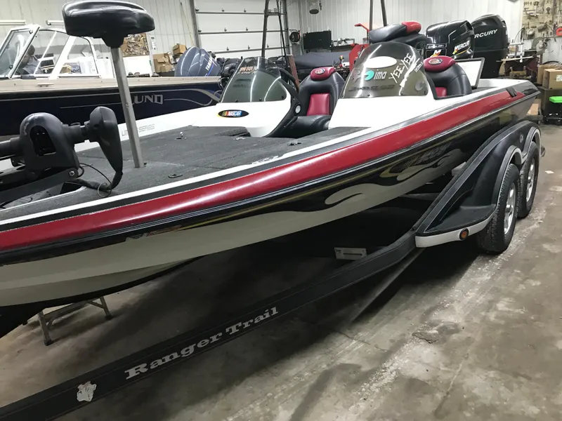 Slide: The Image of 2004 Ranger 519 VX/VS bass boat on trailer in indoor storage. - 17