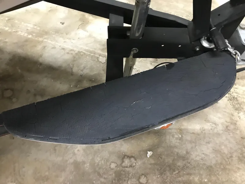 Slide: The Image of 2004 Ranger 519 VX/VS trailer step with black textured surface. - 22