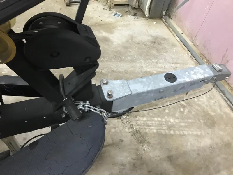 Slide: The Image of Trailer hitch of a 2004 Ranger 519 VX/VS boat, secured with a chain. - 23