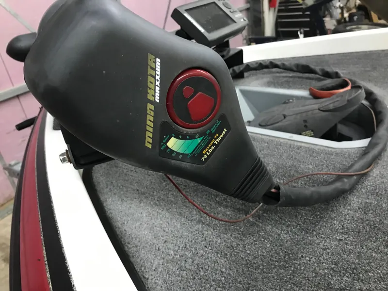 Slide: The Image of 2004 Ranger 519 VX/VS boat with trolling motor and control panel. - 24