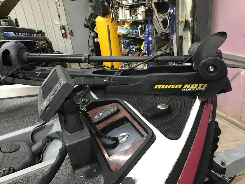 Slide: The Image of 2004 Ranger 519 VX/VS boat with Minn Kota Maxxum trolling motor in a workshop. - 25