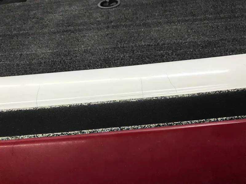 Slide: The Image of Close-up of a 2004 Ranger 519 VX/VS boat interior with visible wear. - 28