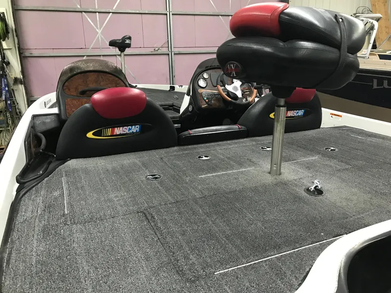 Slide: The Image of 2004 Ranger 519 VX/VS boat interior with NASCAR-themed seats and fishing deck. - 30