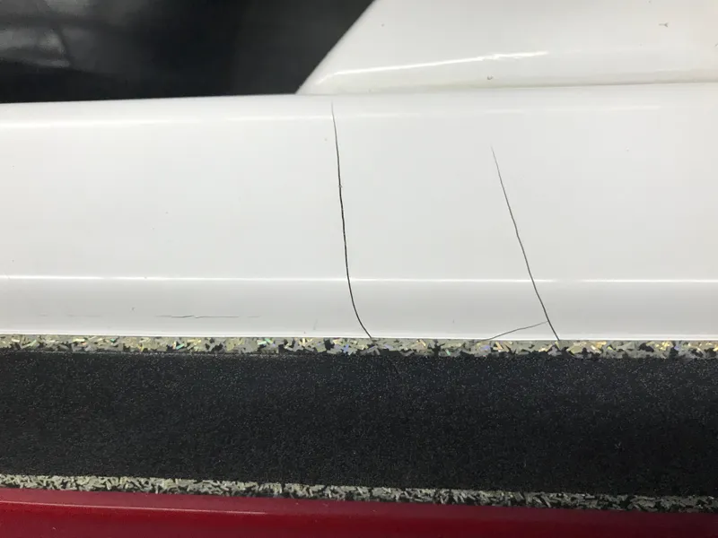 Slide: The Image of Cracks on the white surface of a 2004 Ranger 519 VX/VS boat. - 33