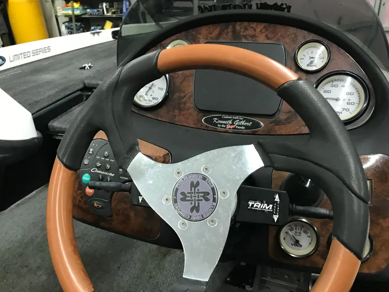 Slide: The Image of 2004 Ranger 519 VX/VS boat dashboard with steering wheel and gauges. - 9