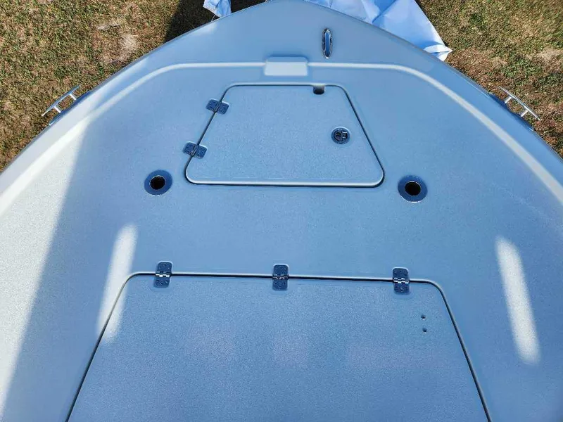 Slide: The Image of Bow deck of 2025 Caymas 281 HB boat with storage compartments. - 1