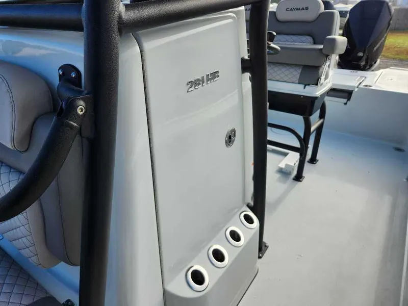 Slide: The Image of 2025 Caymas 281 HB boat interior with seating and storage features. - 11