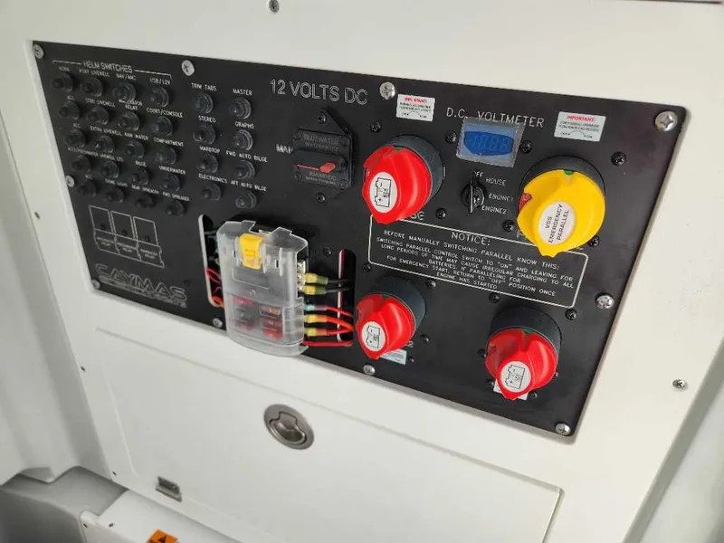 Slide: The Image of Control panel of 2025 Caymas 281 HB boat, featuring switches and voltmeter. - 15