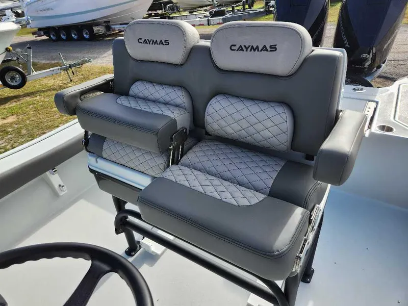 Slide: The Image of 2025 Caymas 281 HB boat seats with gray upholstery and diamond stitching. - 17