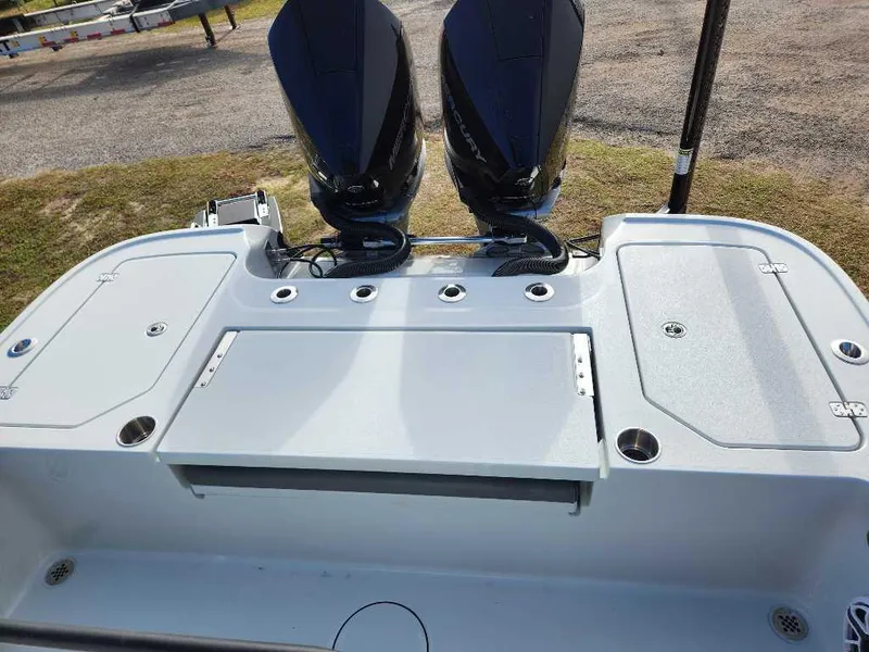 Slide: The Image of 2025 Caymas 281 HB boat with dual outboard motors, rear deck view. - 18