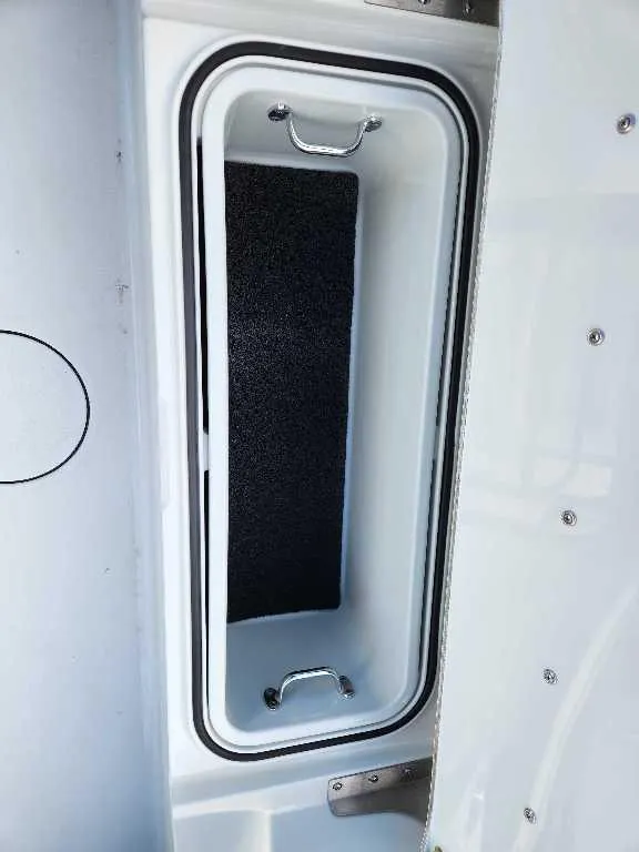 Slide: The Image of Storage compartment of 2025 Caymas 281 HB boat, featuring sleek design and durable handles. - 19