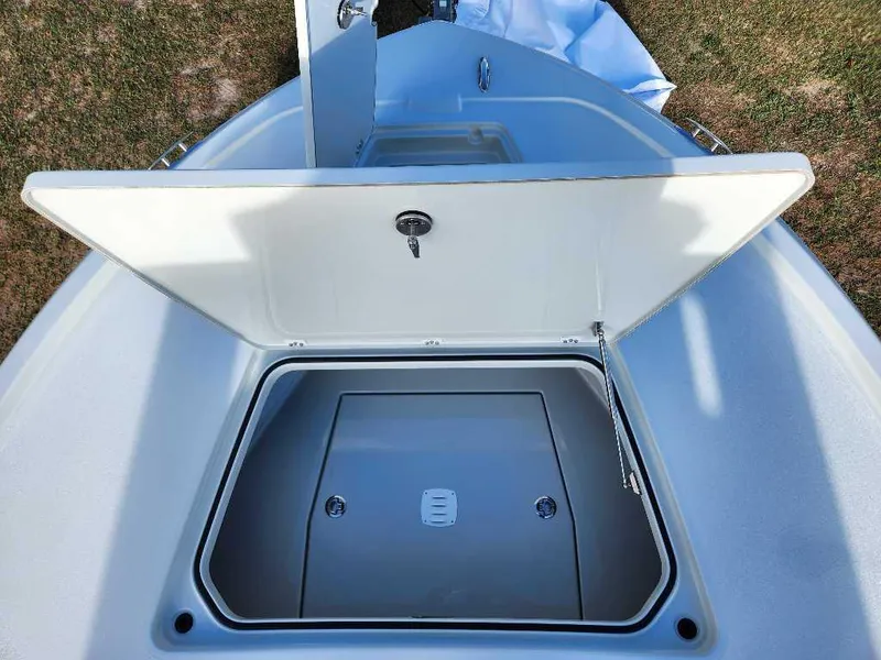 Slide: The Image of Open storage compartment on 2025 Caymas 281 HB boat, showcasing interior space. - 3