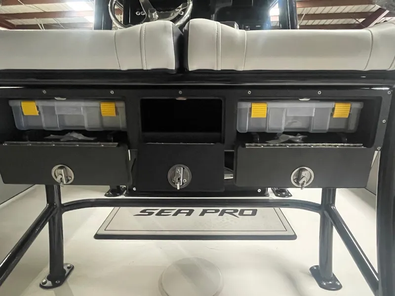 Slide: The Image of 2025 Sea Pro 230 Bay boat storage compartments and seating area. - 15