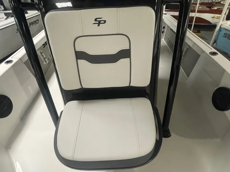 Slide: The Image of 2025 Sea Pro 230 Bay boat seat with logo, featuring sleek white and gray design. - 6