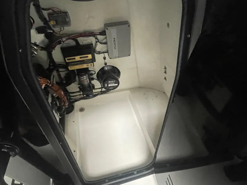 Slide: The Image of Interior view of 2025 Sea Pro 230 Bay boat's electrical and mechanical components. - 8