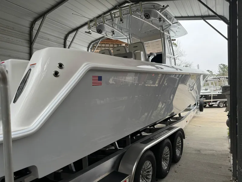 Slide: The Image of 2026 Contender 39 ST boat on trailer in covered storage. - 10