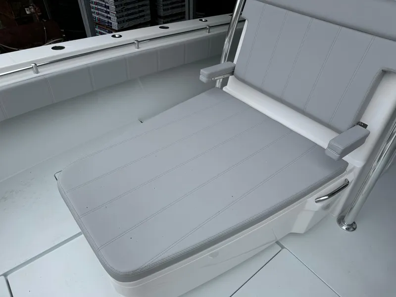 Slide: The Image of Contender 39 ST 2026 boat with gray cushioned seating and armrests. - 21