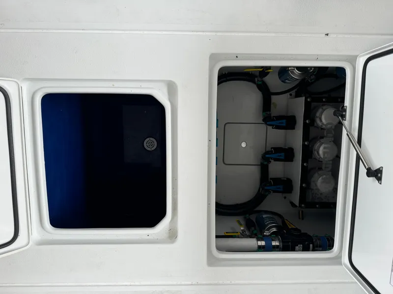 Slide: The Image of Contender 39 ST 2026 boat compartments, showcasing storage and mechanical access. - 23