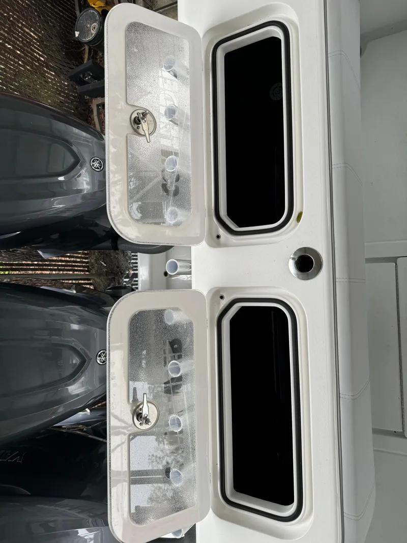 Slide: The Image of 2026 Contender 39 ST boat with dual livewells and powerful outboard engines. - 25