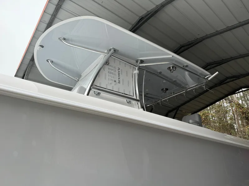 Slide: The Image of 2026 Contender 39 ST boat under a metal canopy, showcasing sleek design and structure. - 27