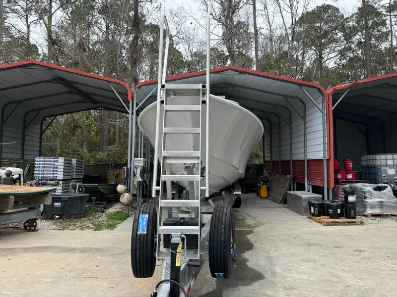 Slide: The Image of 2026 Contender 39 ST boat on trailer in covered storage area. - 4