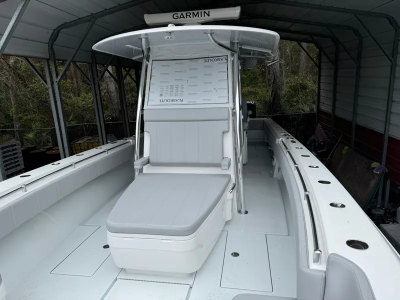 Slide: The Image of 2026 Contender 39 ST boat with Garmin equipment, docked under a shelter. - 8