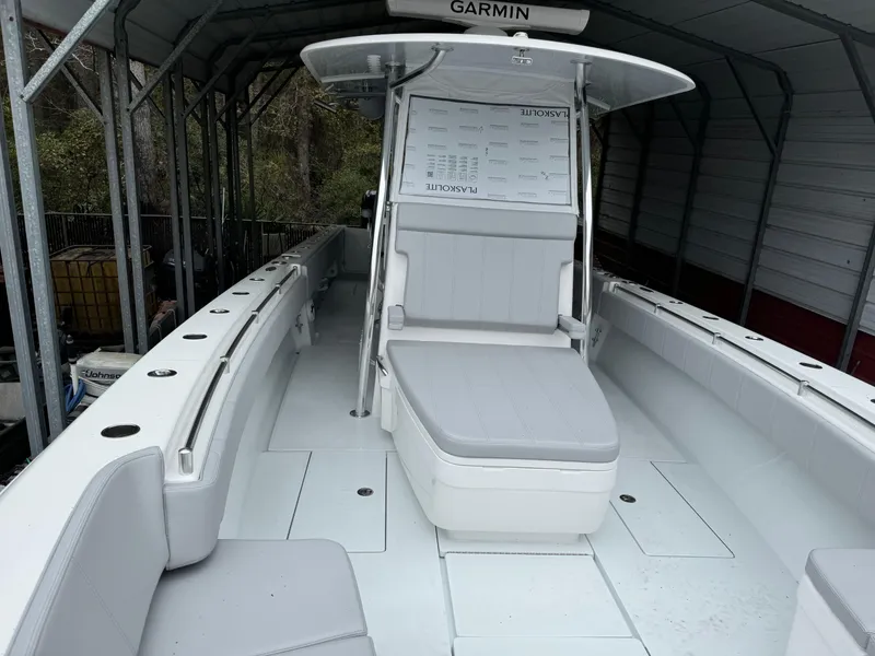 Slide: The Image of 2026 Contender 39 ST boat interior with seating and Garmin equipment. - 22