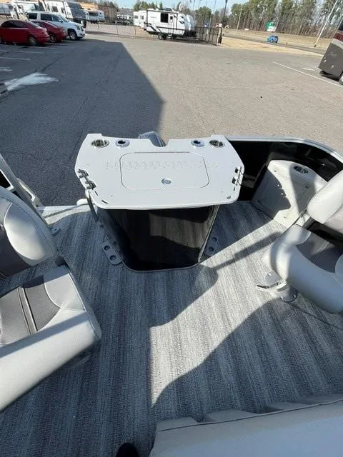 Slide: The Image of 2025 Bennington 18 SXFSE boat interior with seating and storage compartment. - 8