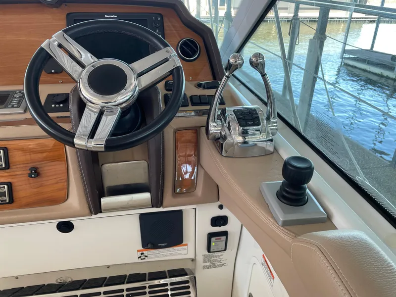 Slide: The Image of Helm of 2008 Cobalt 46 yacht with steering wheel and controls. - 11